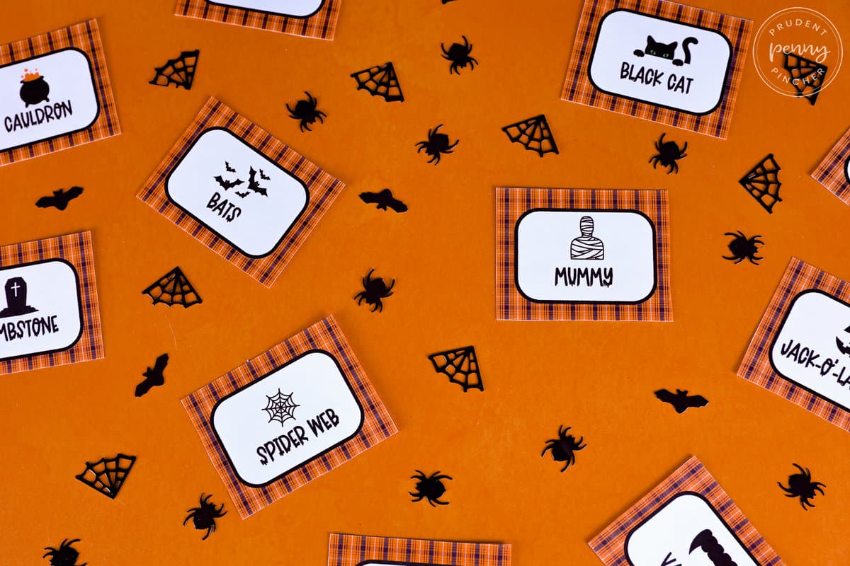cards on orange background with black confetti