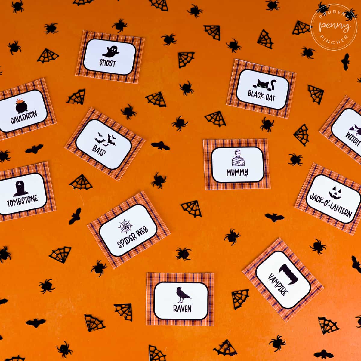 charades cards on orange background with black confetti
