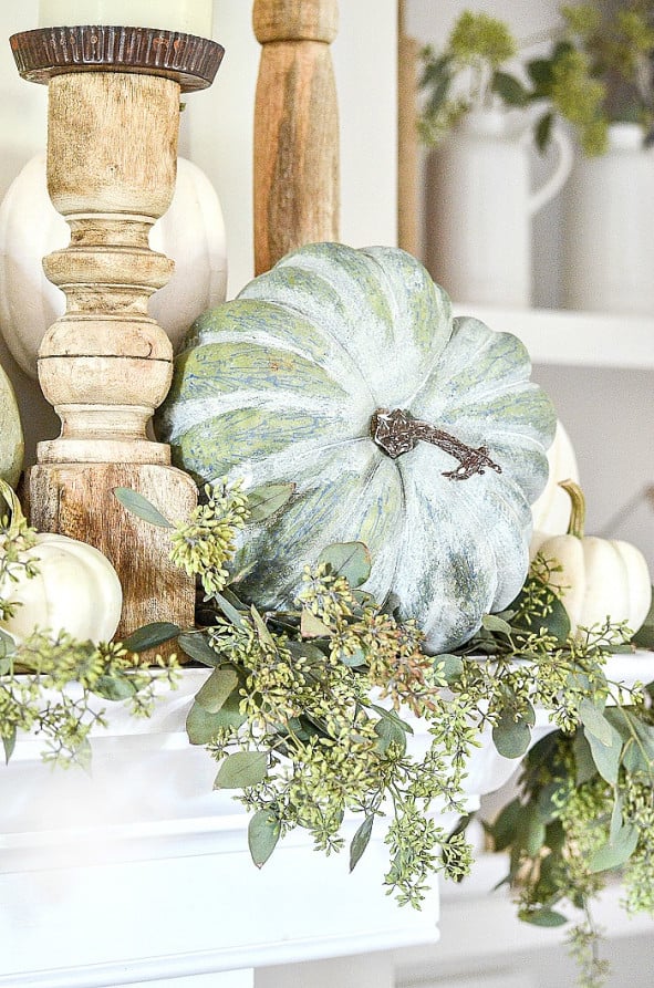 greenery and pumpkins mantel