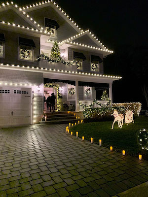 christmas lights on exterior of home and walkway