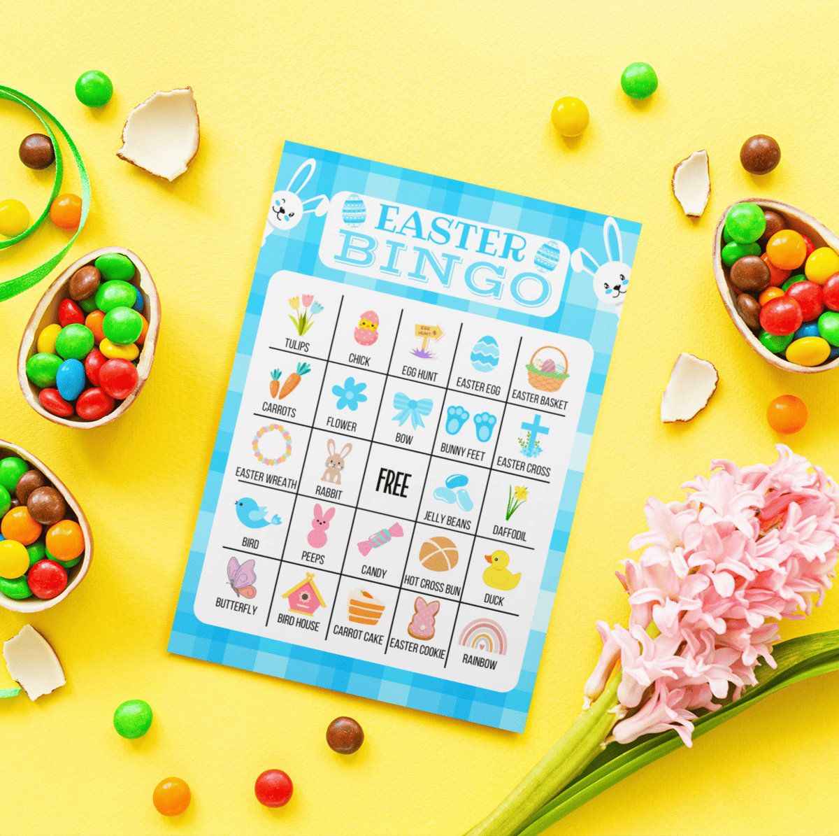 free printable easter bingo cards on yellow background with easter M&Ms and flowers