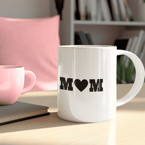 White coffee mug with MOM heart SVG design