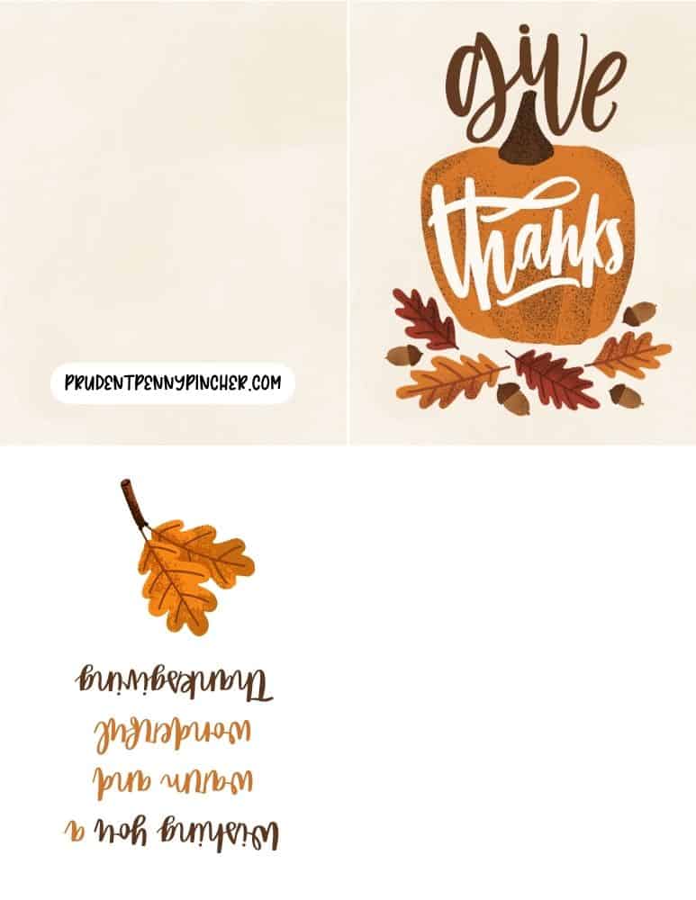 Thanksgiving card with an orange pumpkin and the phrase "Give Thanks" in white script surrounded by autumn leaves.