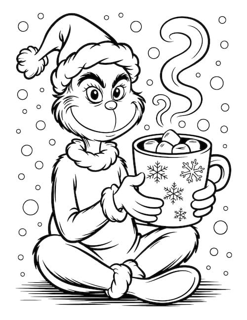 Grinch sitting cross-legged in the snow holding a big mug of hot cocoa