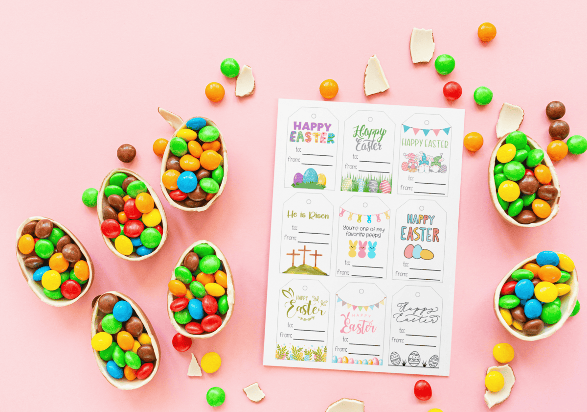 page surrounded by candy-filled chocolate egg shells on a pink background.