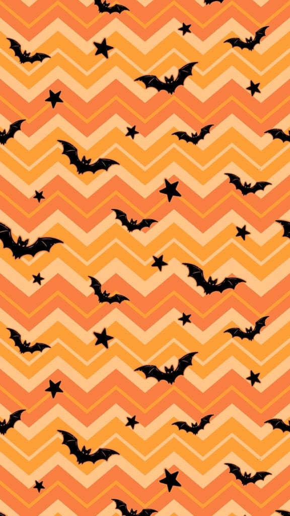 Black bats and stars over orange retro chevron stripes retro halloween wallpaper