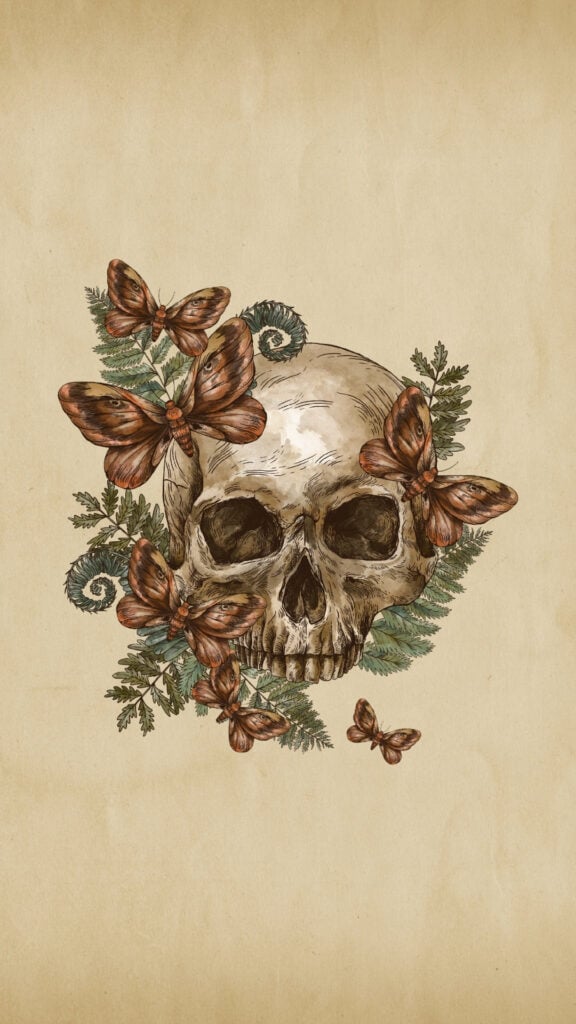 Antique skull surrounded by moths and botanical greenery