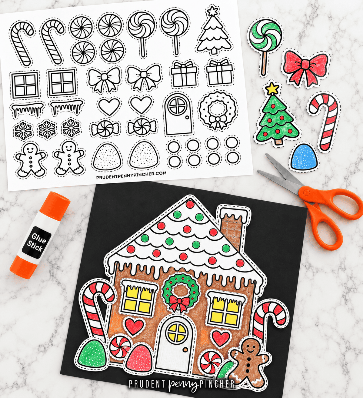 Gingerbread house Christmas craft with an uncolored printable decorations sheet, colorful cutout pieces, scissors, glue stick, and a finished paper house on black construction paper.
