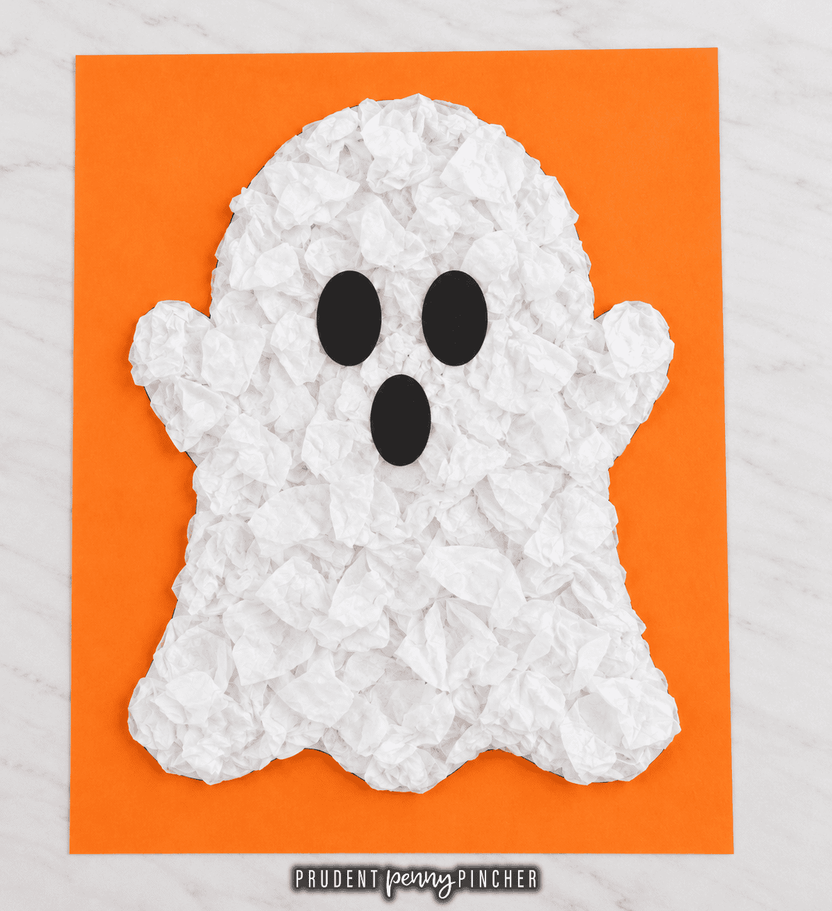 tissue paper ghost craft made with crumpled white tissue paper on orange construction paper